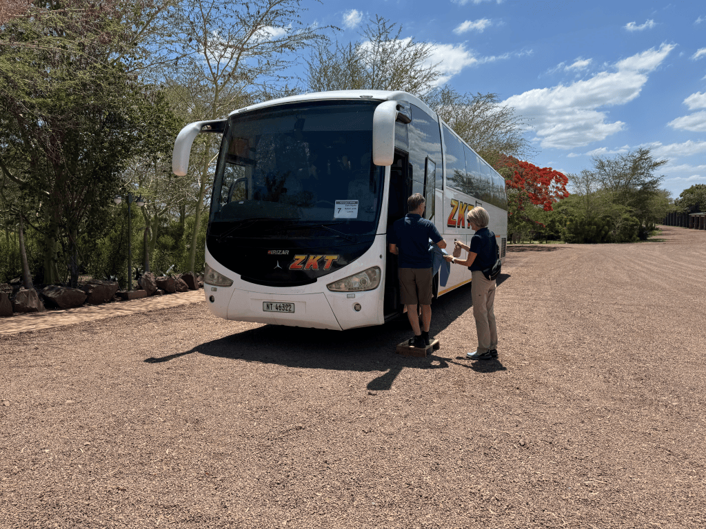 A motor coach to take passengers to the Safari Game Reserve
