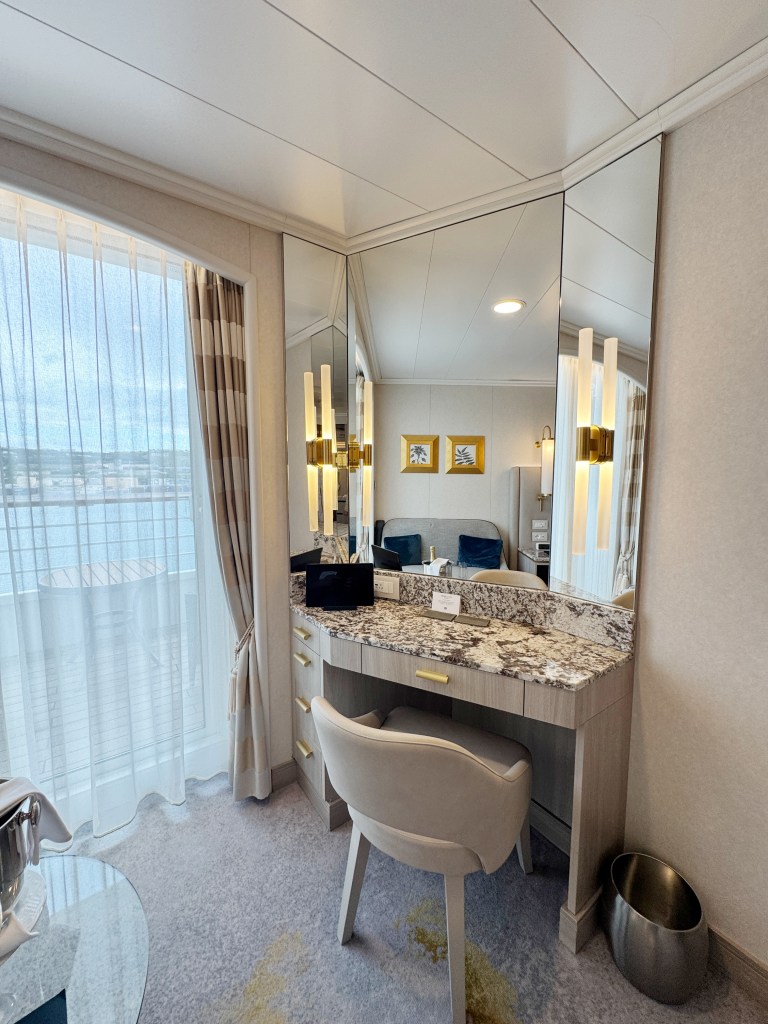 A compact desk area next to the veranda door.