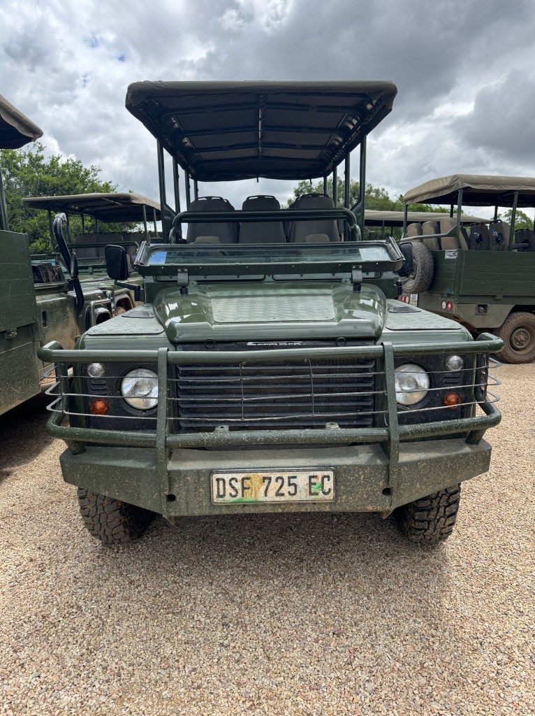 Front view of a green safari Jeep