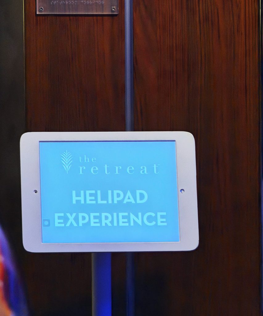 A sign saying The Retreat, Helipad experience