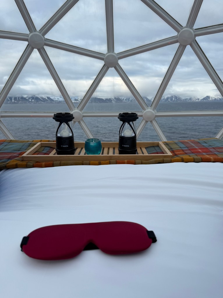 Lights and eye mask on the bed in the Igloo on National Geographic Resolution