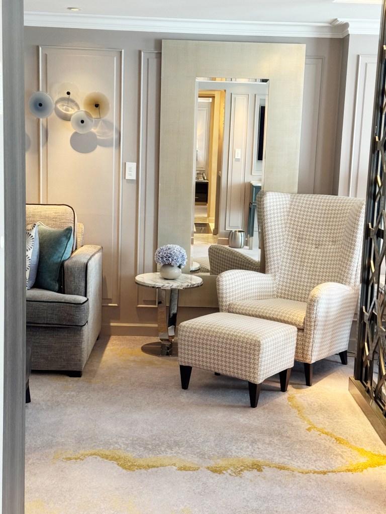 An armchair and foot stool in the Lounge area of the Crystal Penthouse.