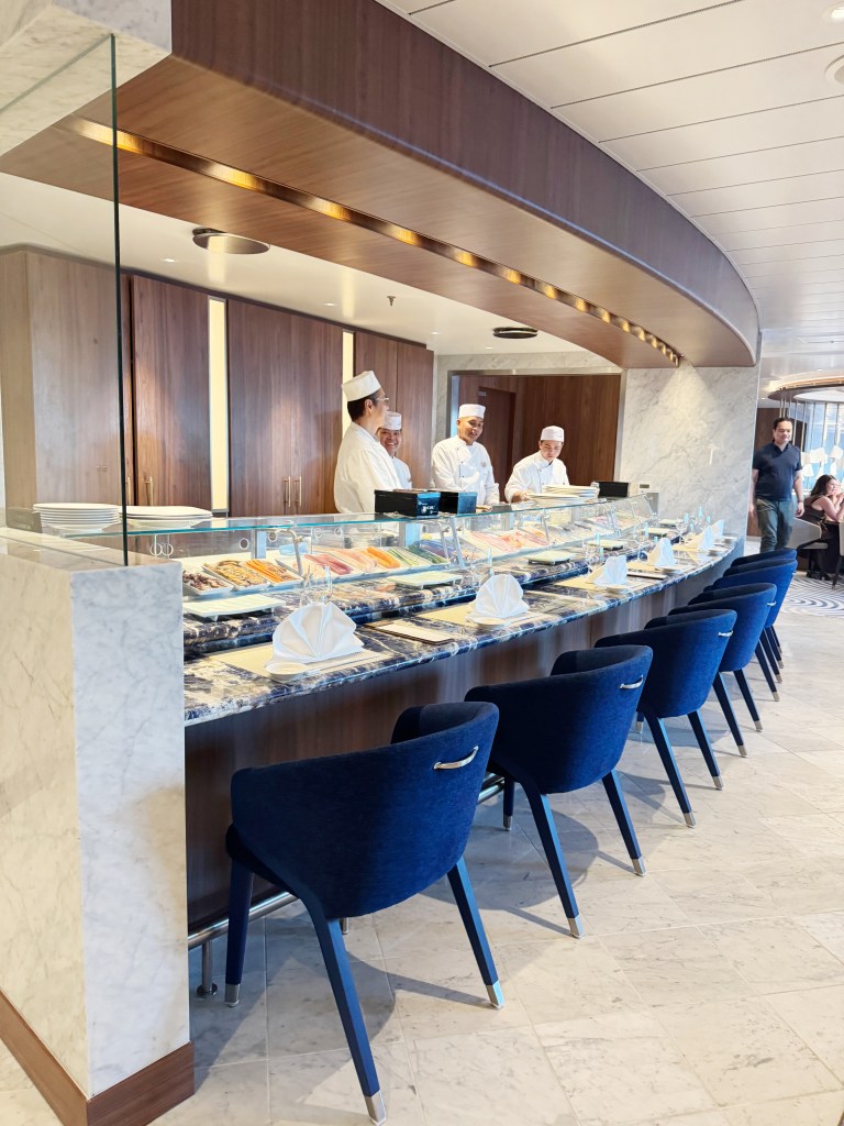 3 chefs working at an open restaurant in Umi Uma