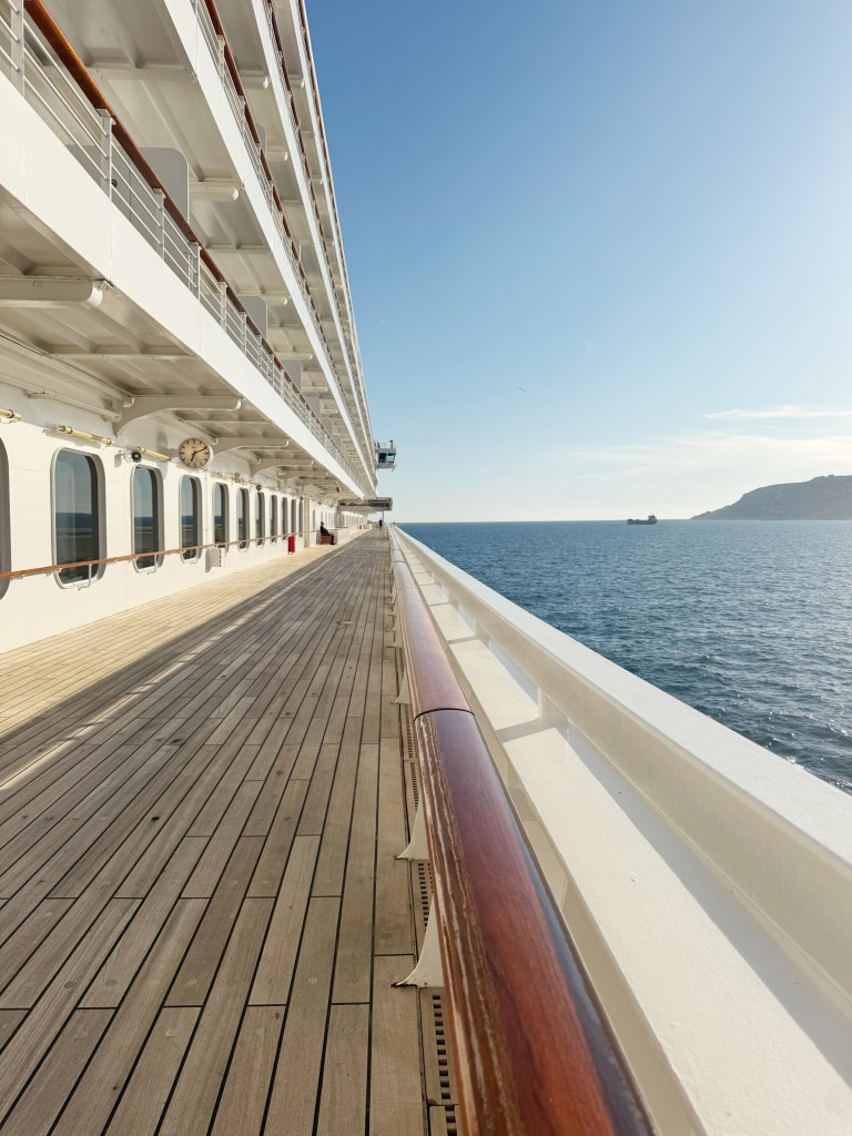 A look down the empty promenade deck of Crystal Serenity, whilst at sea.