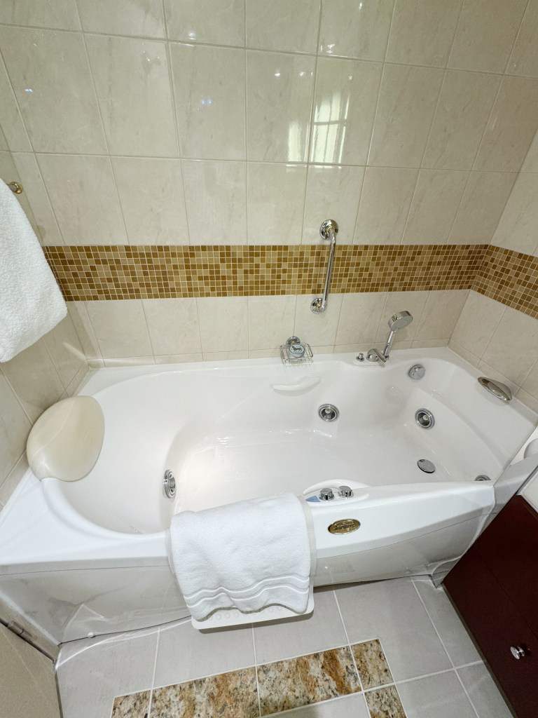 A Spa bath, with jets noticeable.